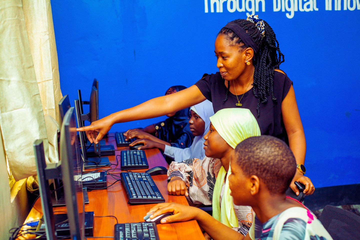 Girls learning digital skills at the CODEWA GDASH, Tabora