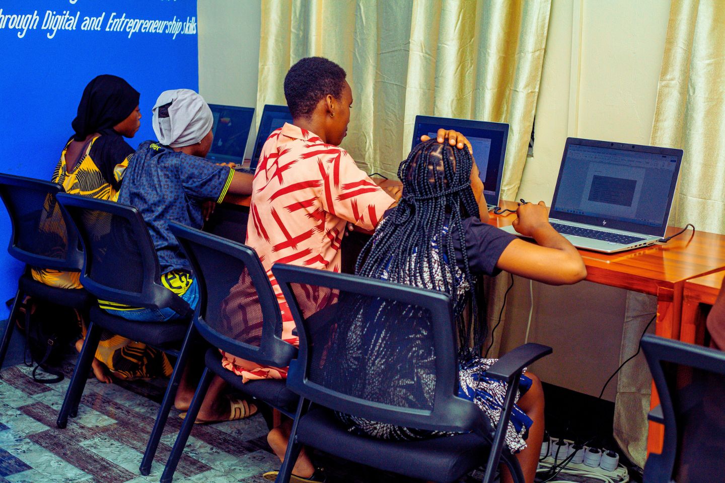 Girls Digital Hub participants learning digital skills in Tabora
