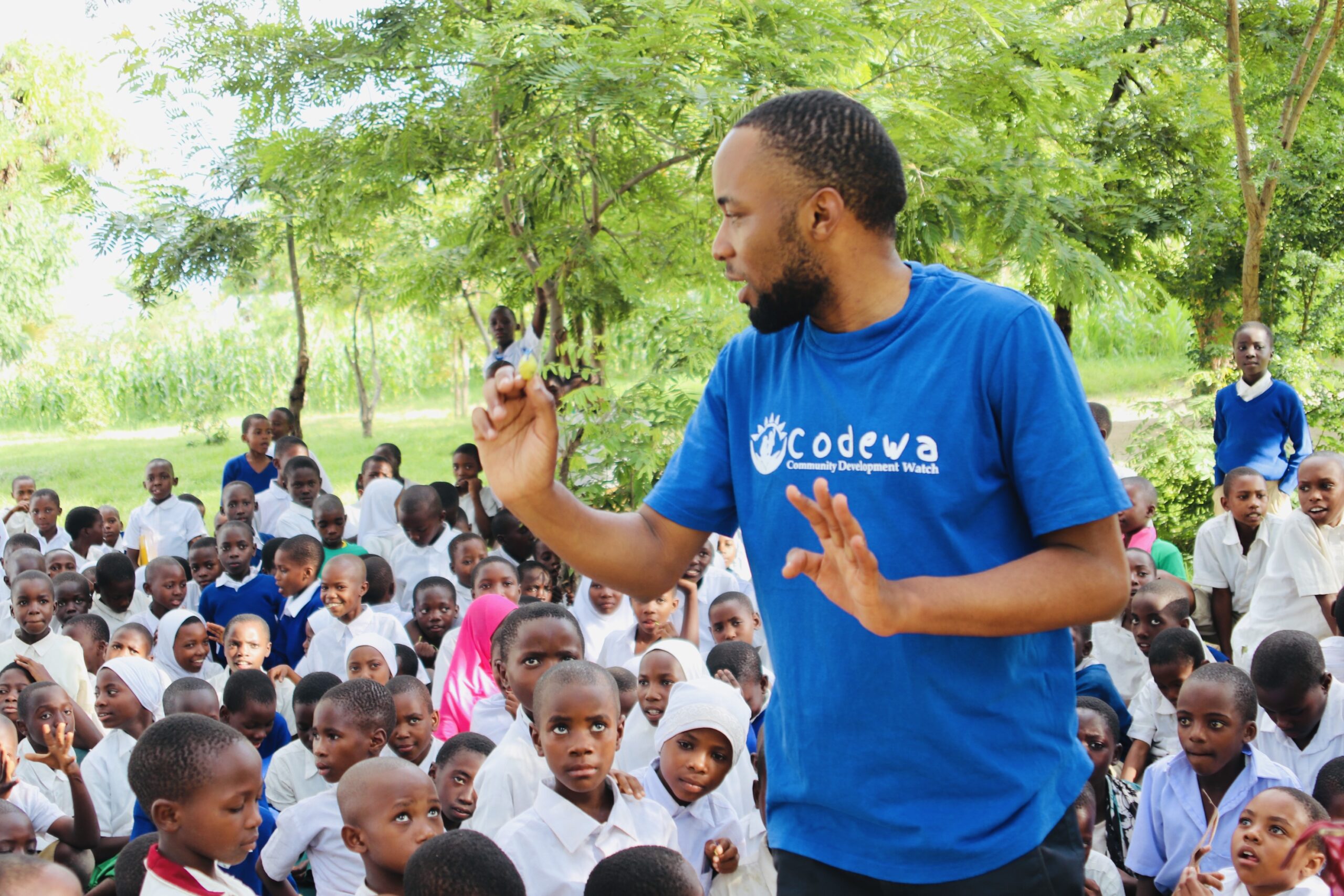 CODEWA founder Sadath A. Mwamsema with children in Tanzania