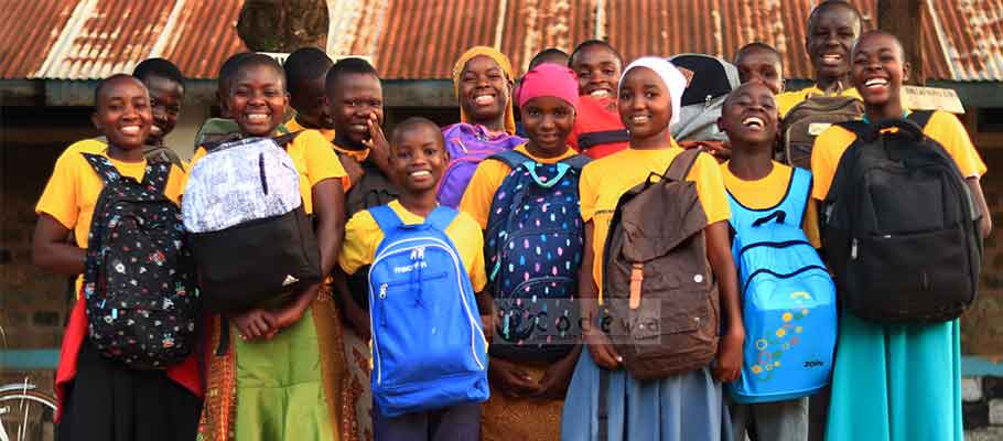 Students with school kits in Tabora