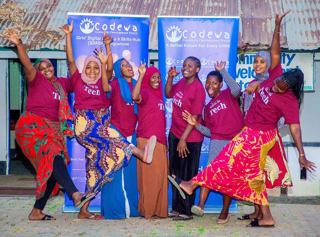 Girls smiling during Canva design session